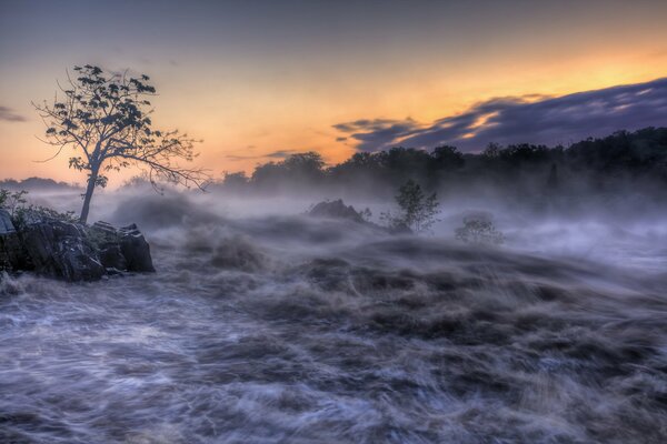 Heady fog with a beautiful sunset on the river