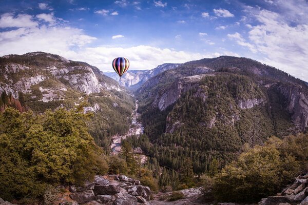 California, Yosemite. The balloon rises above the rocks