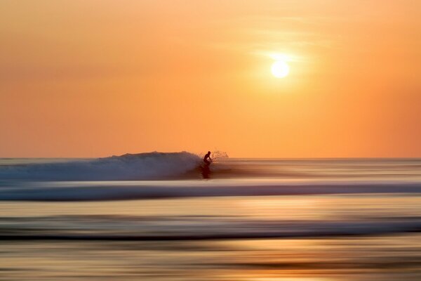 Landscape from the sea on the background of the setting sun