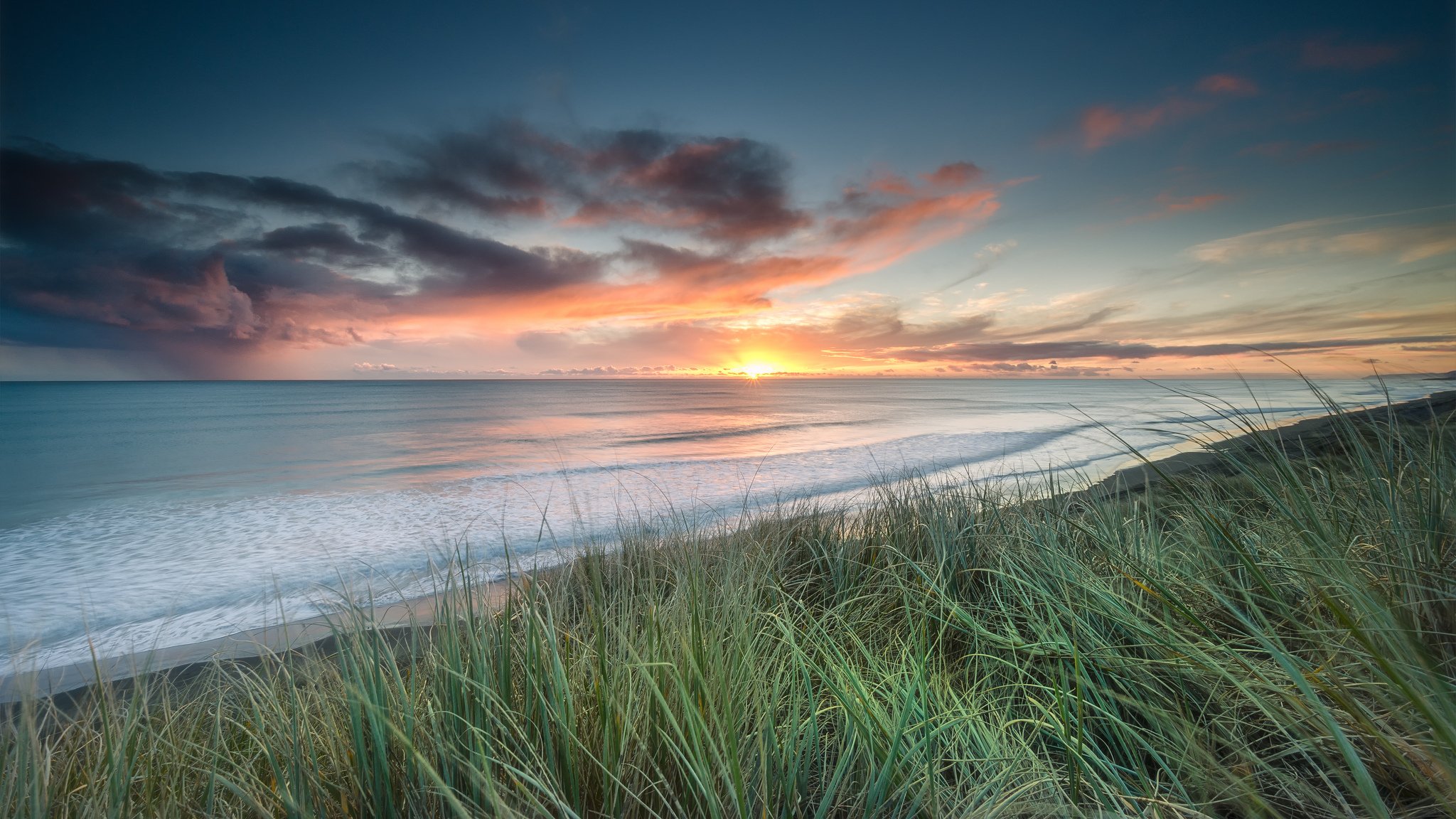 nuova zelanda fiume waikato estuario spiaggia erba sole tramonto