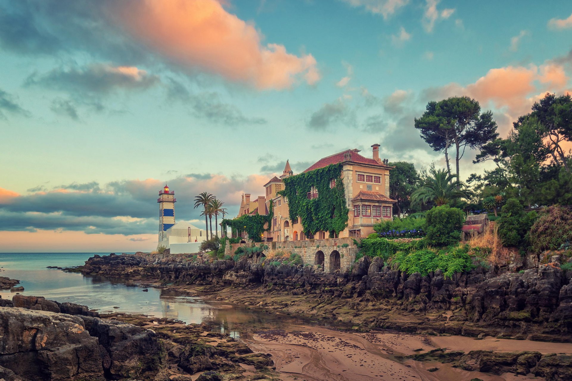 lighthouse villa landscape beach stones ocean