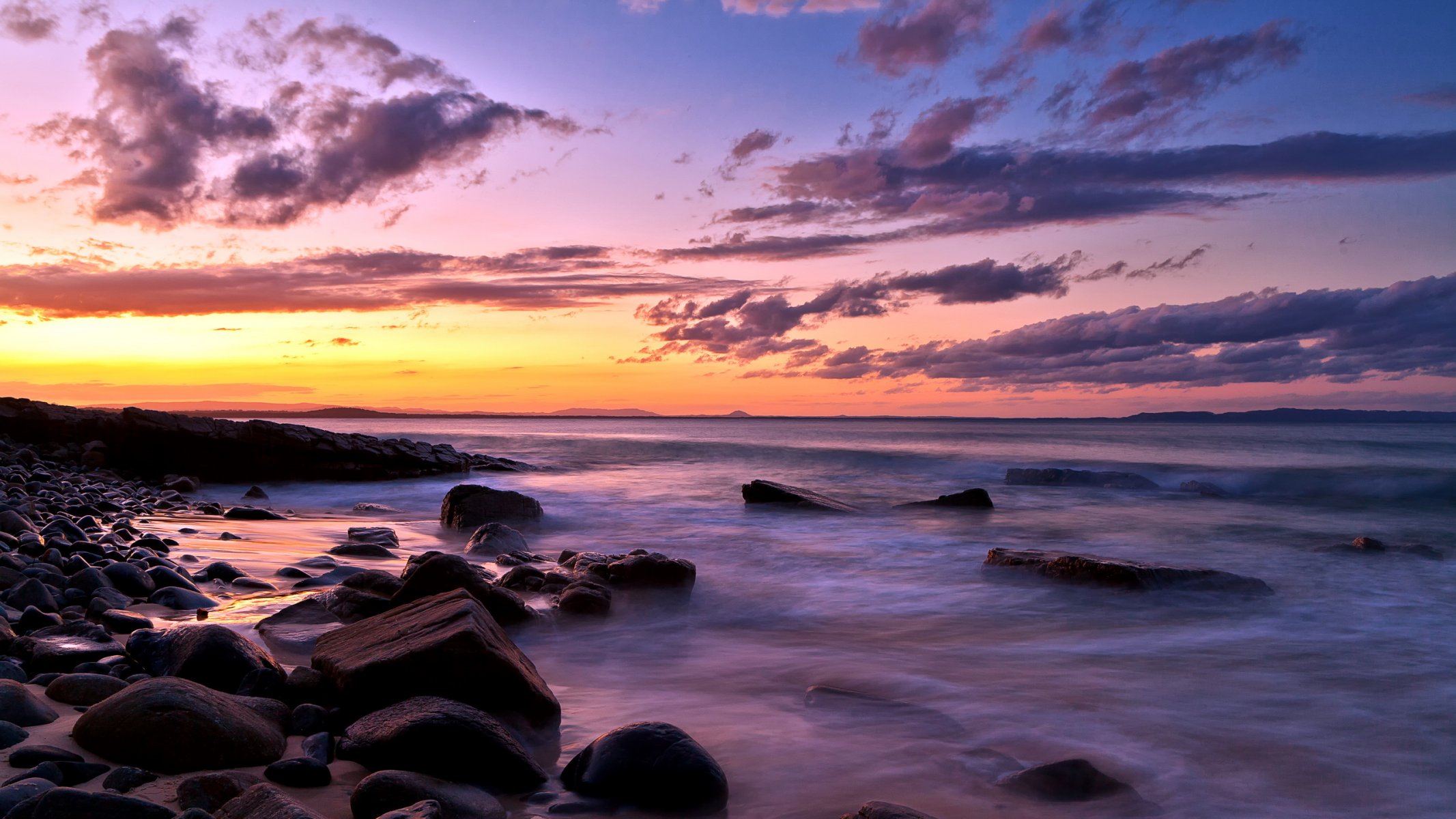 puesta de sol mar rocas paisaje