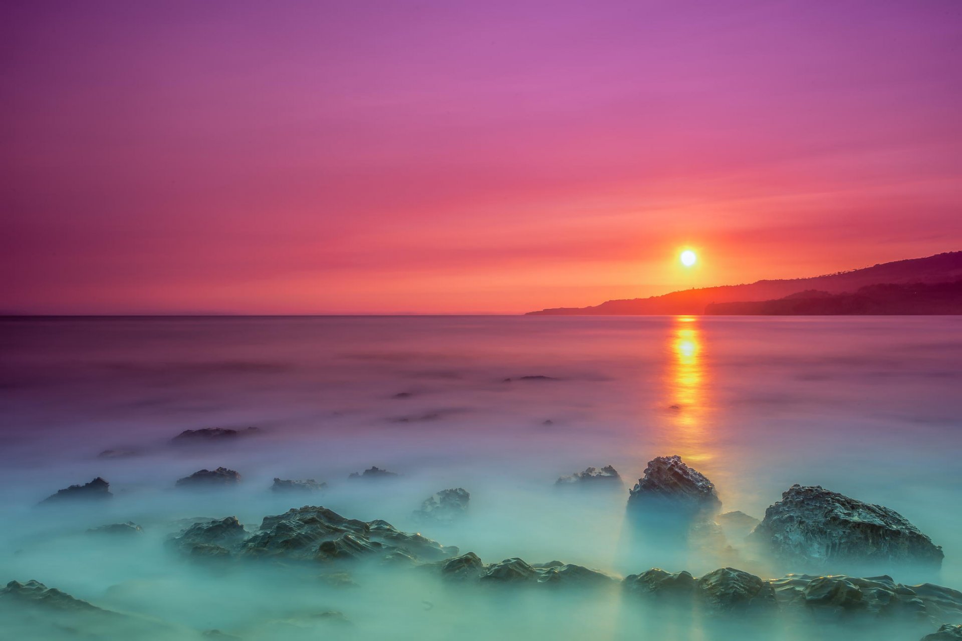 amanecer sol costa rocas océano