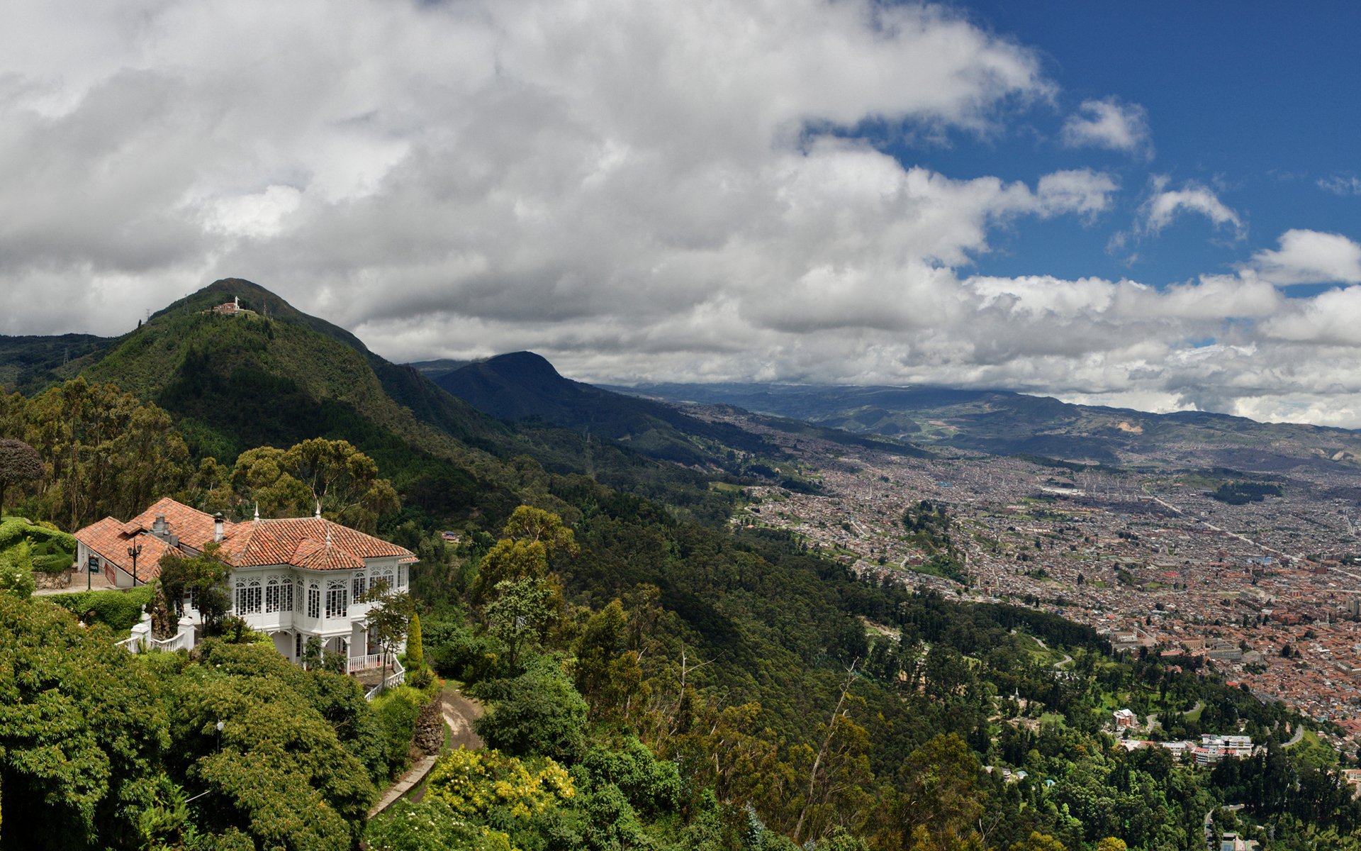 bogota colombia sky clouds mountain town valley house villa