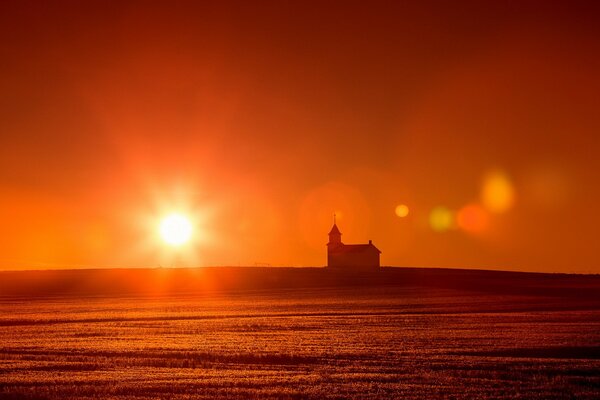 Scarlet sunset on the balcony of the church