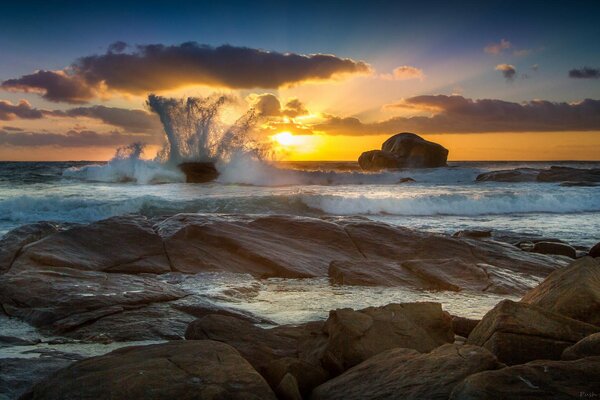 Waves crashing on a stone beach