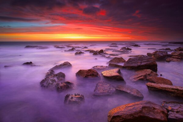 Misty dawn on the sea where the stones lie