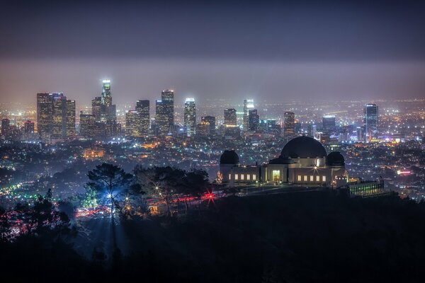 Observatory on the background of a beautiful night city