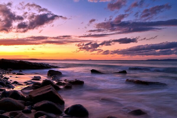 Sea rocks sky clouds