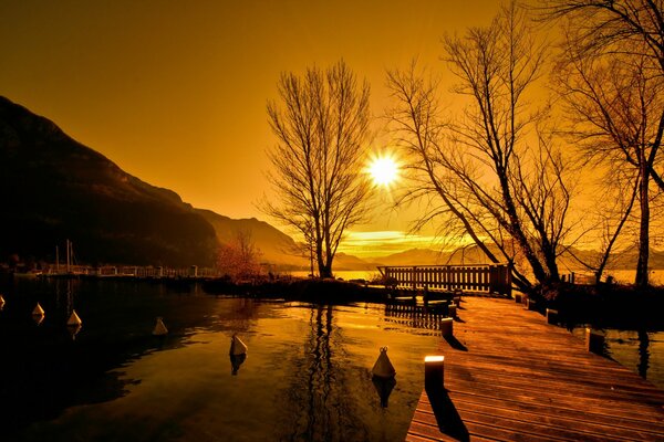 Landscape bridge on the lake at sunset