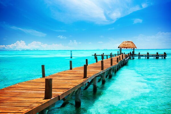 On the seashore with a bridge and a gazebo