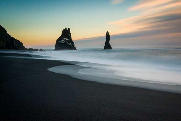 Iceland. Black sands on the beach by the sea