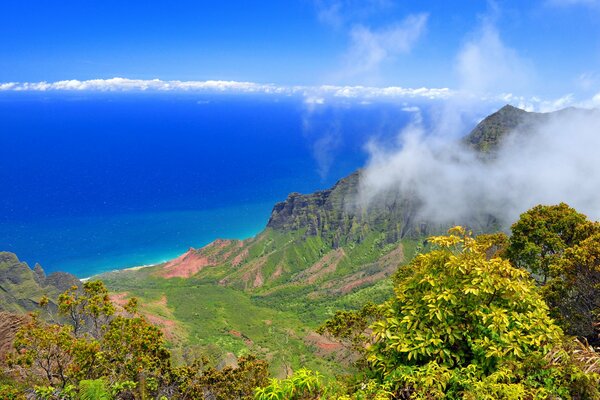 Clouds over the mountains and the sea on the horizon