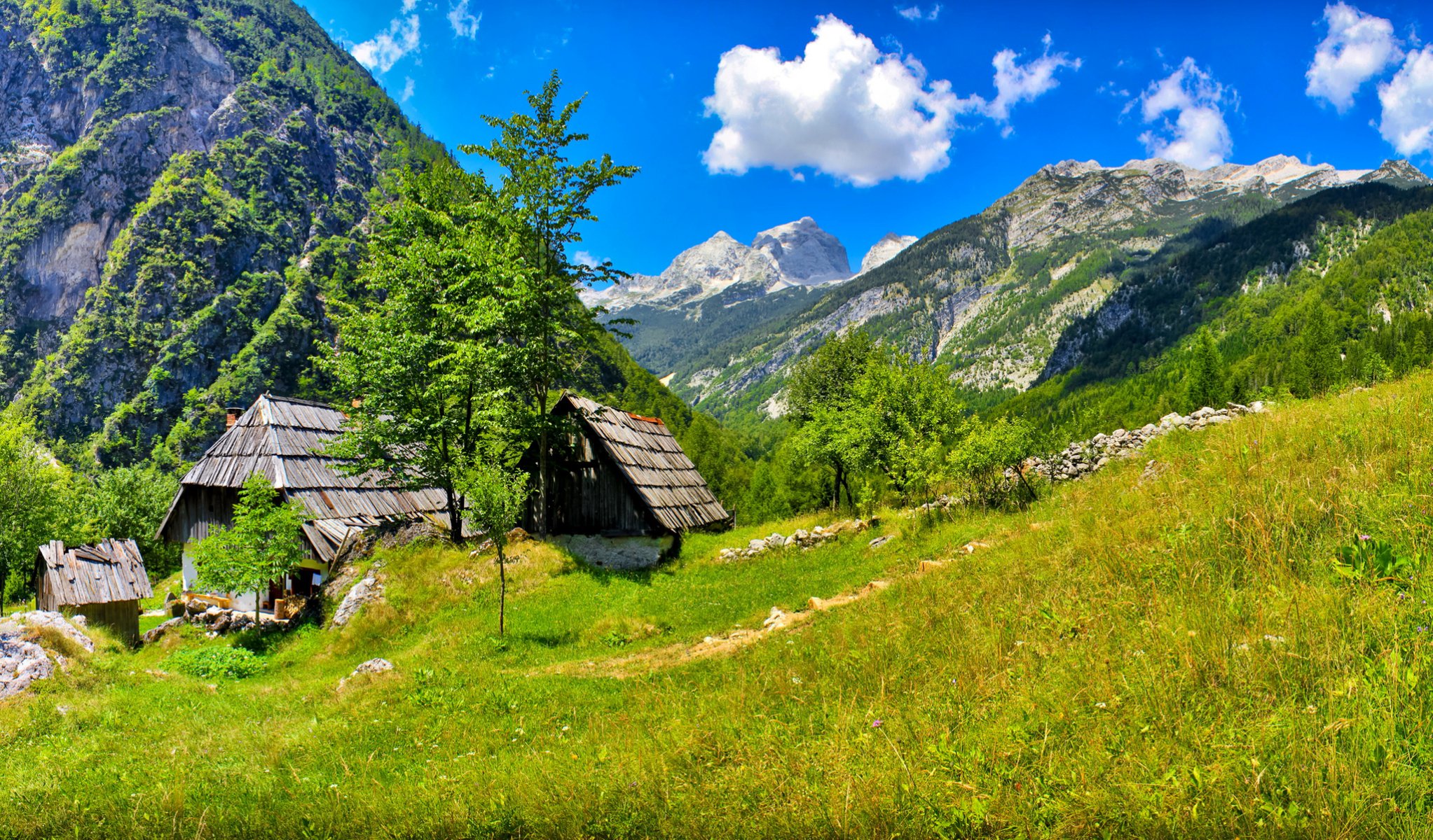 bovec slovenia sky clouds mountain house tree grass nature