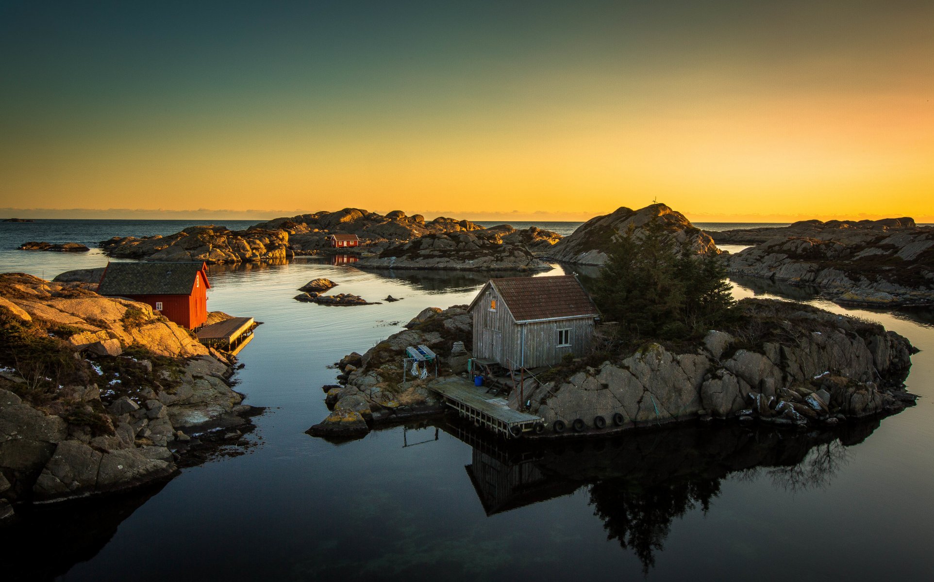 houses sea rocks tires pier sunset rock