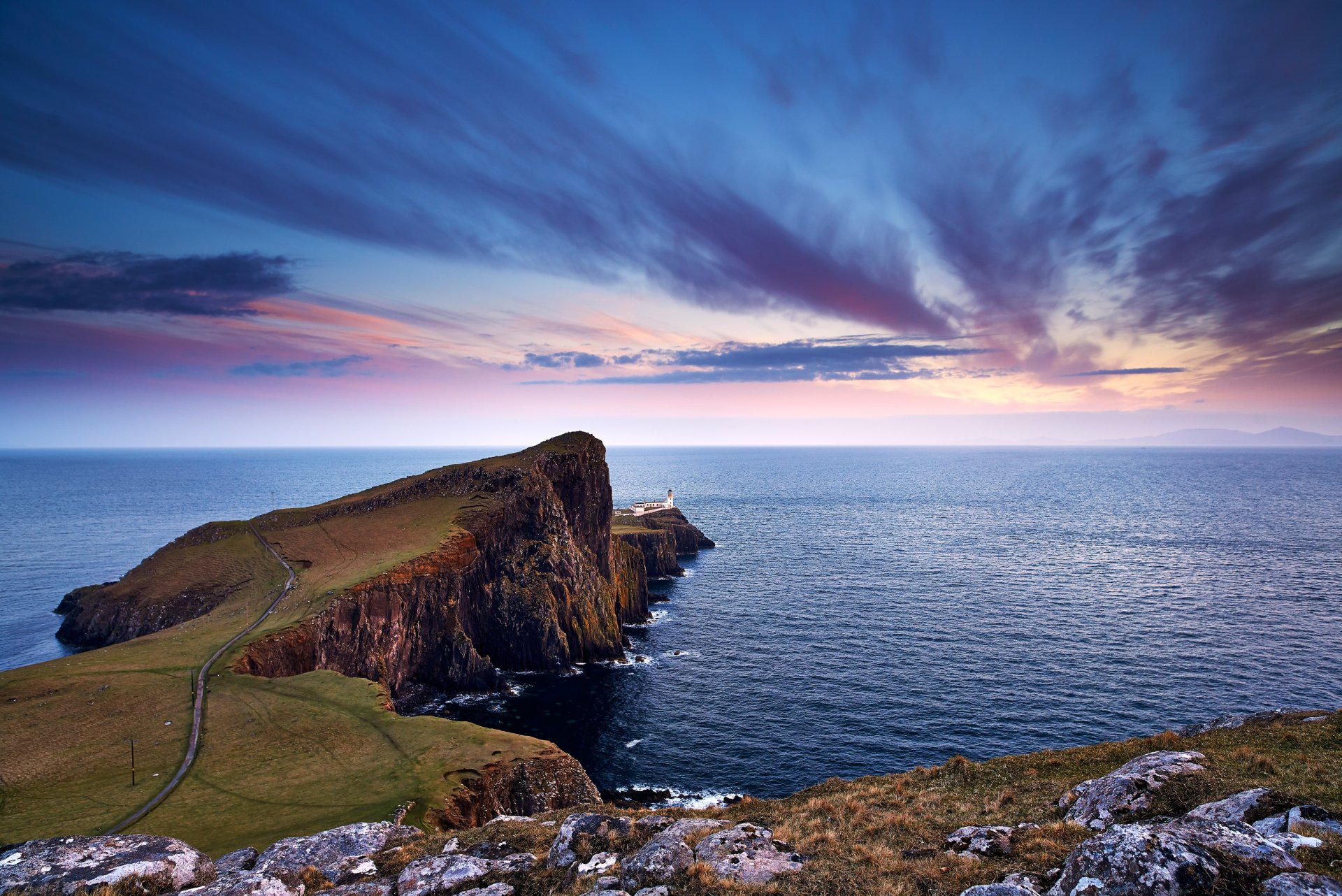 neist point scotland sky clouds night sea cape road lighthouse stone