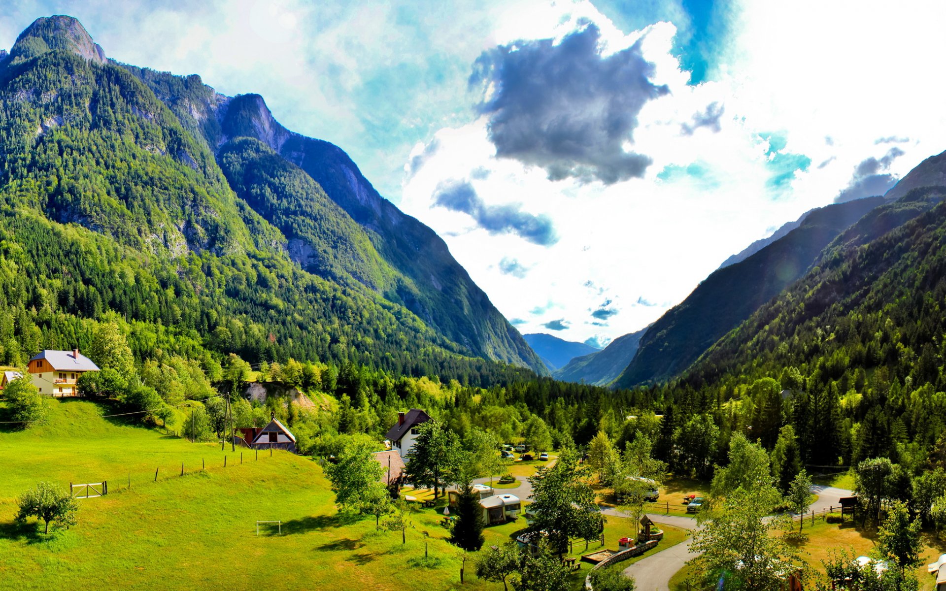 bovec slovenia sky clouds mountain house tree grass nature road valley