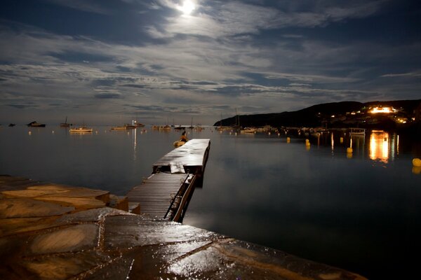 Night landscape bridge on the lake