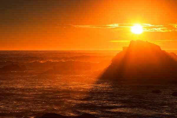 Storm at sea at sunset