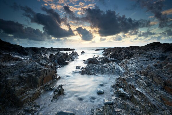 Landscape sea rocks and clouds