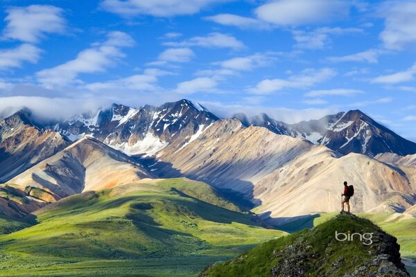 A traveler in the mountains near the clouds