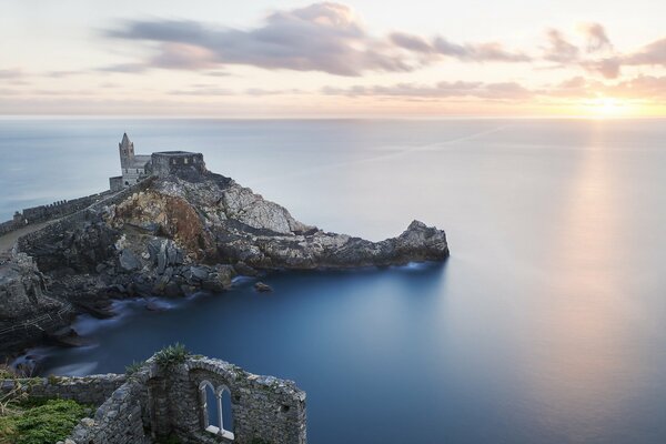 Ruins of a castle on a mountaintop near the sea