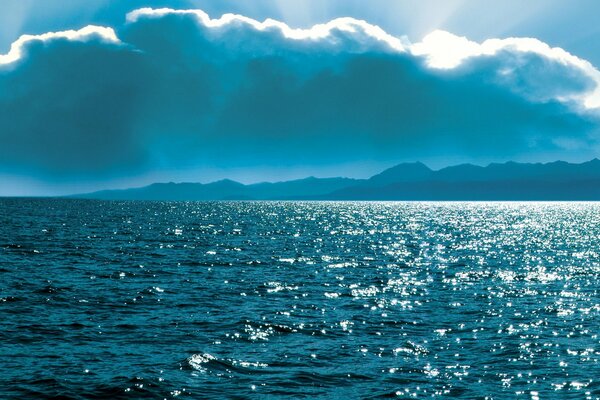 The rays of the sun peeking out from behind the clouds over Lake Baikal