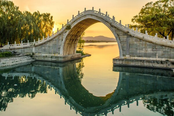 The bridge of an interesting design stood over the river