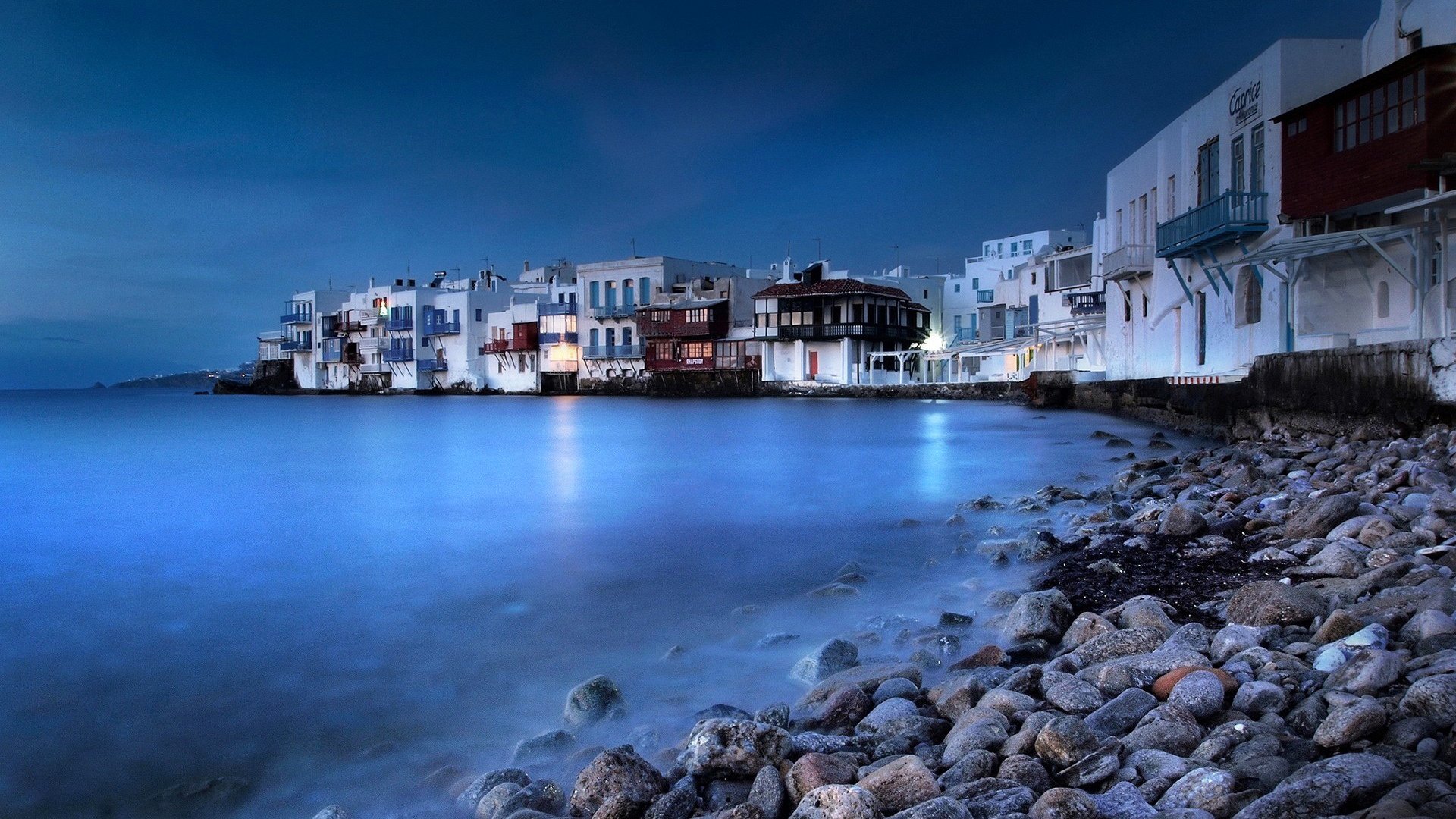 mykonos grecia isla noche cielo mar ciudad casas