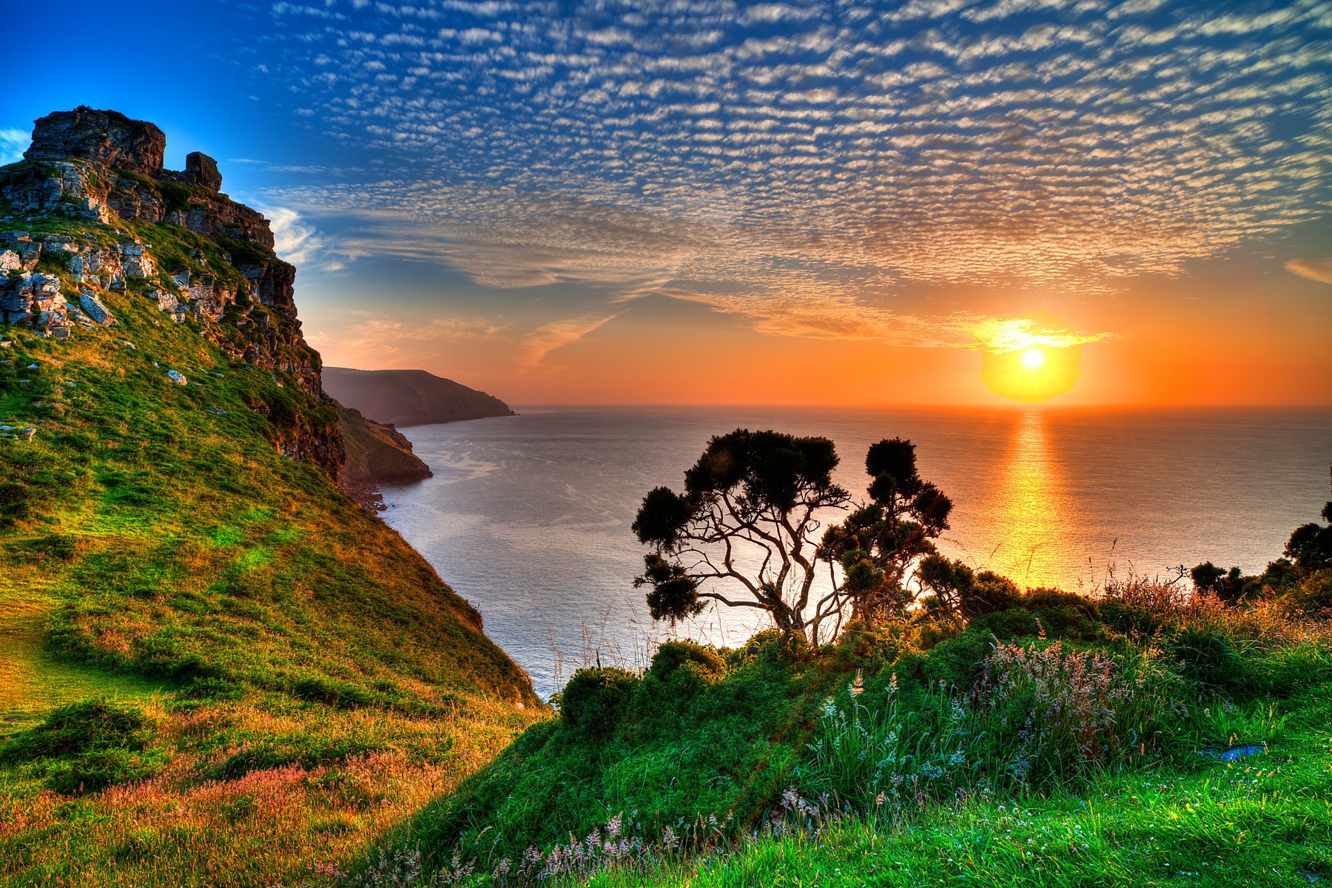 gb exmoor sky clouds sun sunset rock grass mountain tree sea horizon reflection