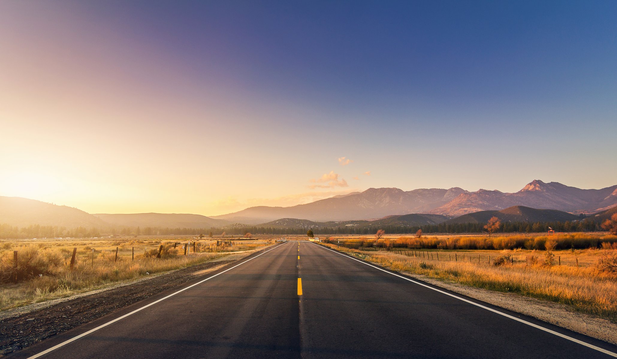 road fence mountains sunset bridge