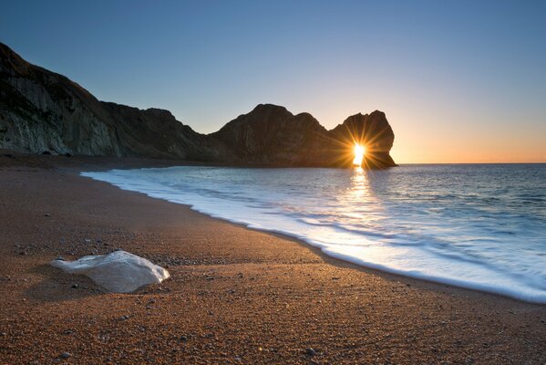 The Jurassic coast in England. The sun and the rocky Gate