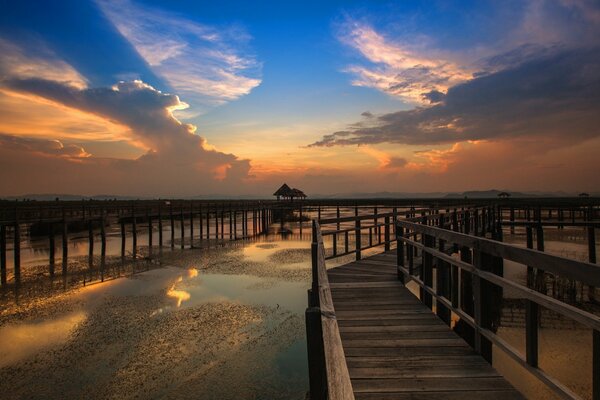 Sunset on the sea, with a view of the bridge