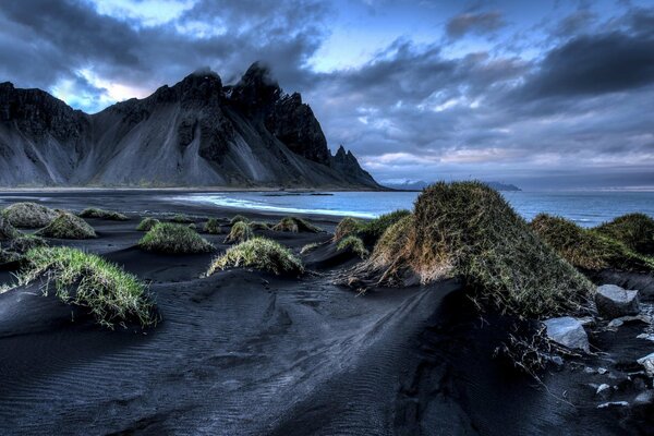 Iceland. Black sand on the shore. Twilight