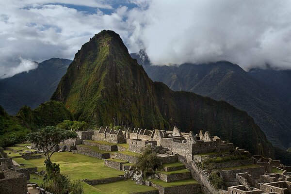 Ruins of Machu Picchu at the foot of the mountain