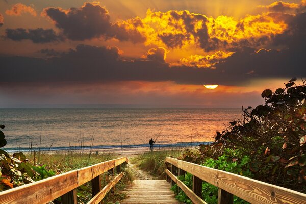 Fishing at sunset. The road to the sea