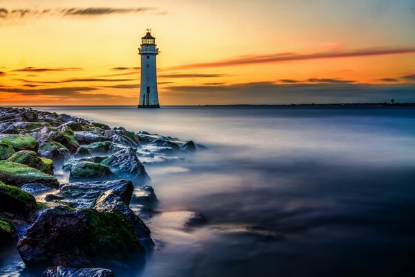 The lighthouse is located near the seashore