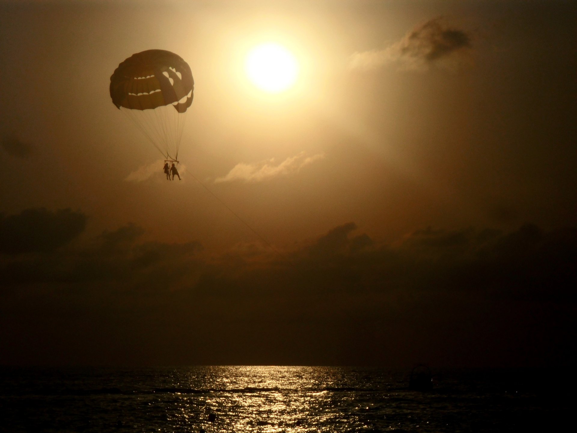 unset sun sea sochi parachute clouds the pair romance sports black sea reservoir