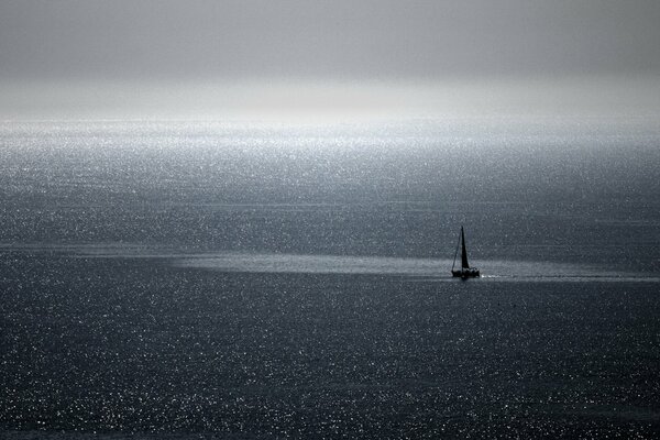 A yacht was visible on the horizon in the sea