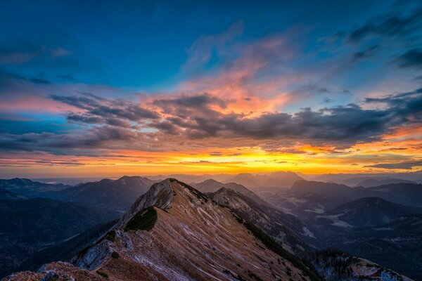 Snow-capped mountain peaks at sunset