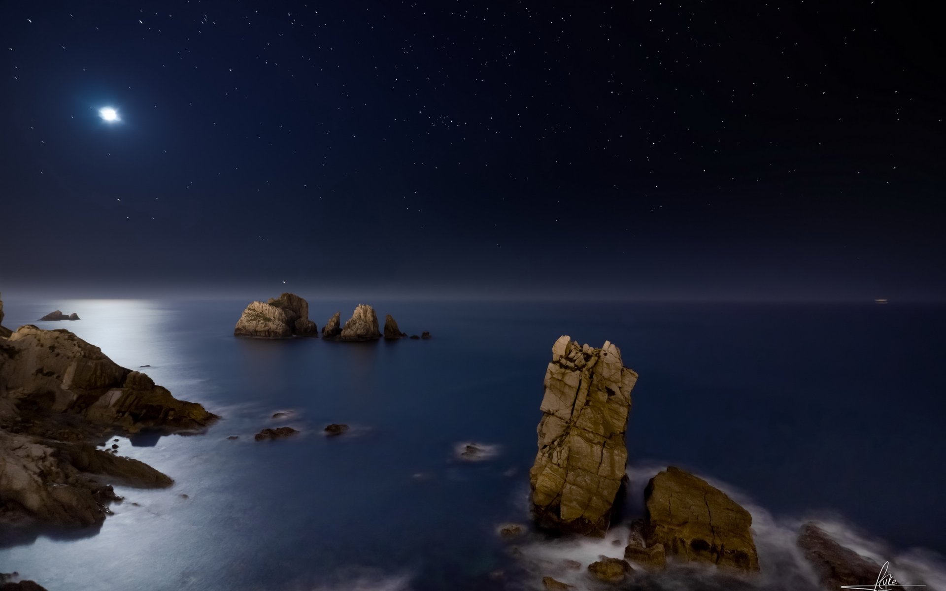 mar noche rocas