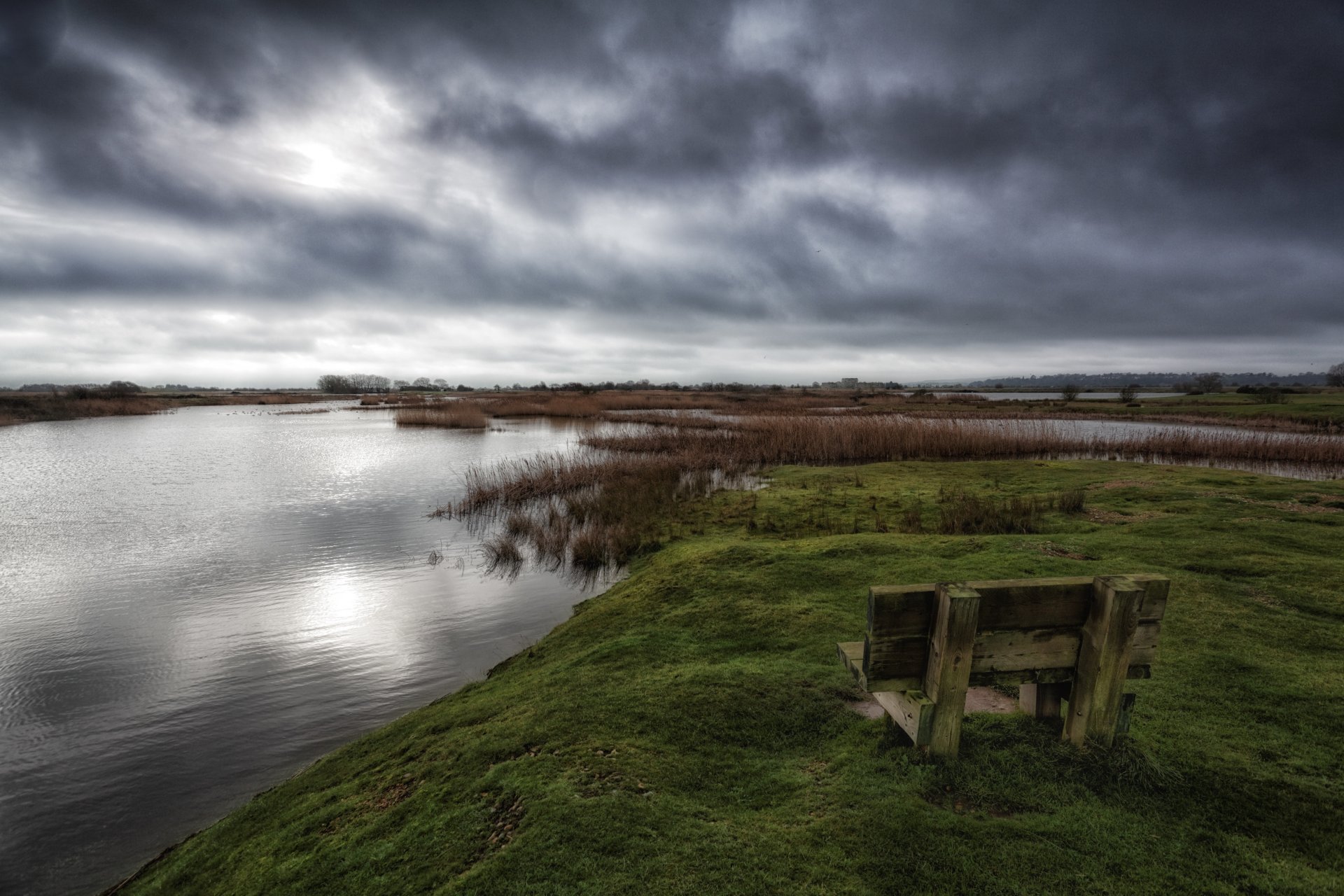 hop bench grass clouds pond lake water darkly