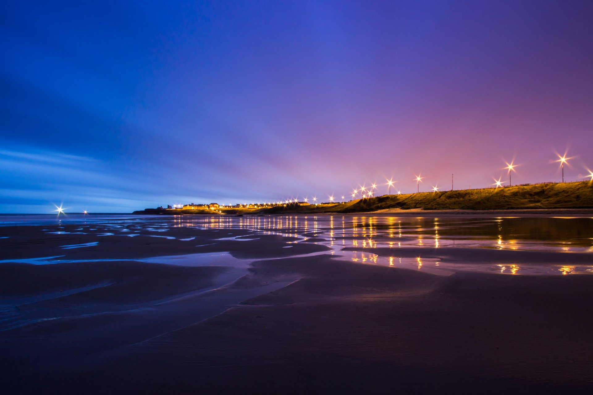 united kingdom england north sea tide beach coast lighting lights lamps night blue purple sky