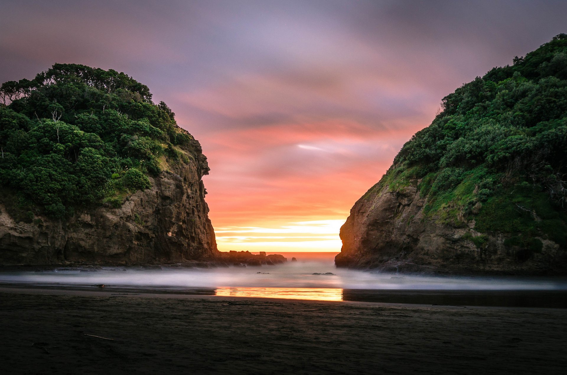 bethells plage auckland nz aube plage rochers océan