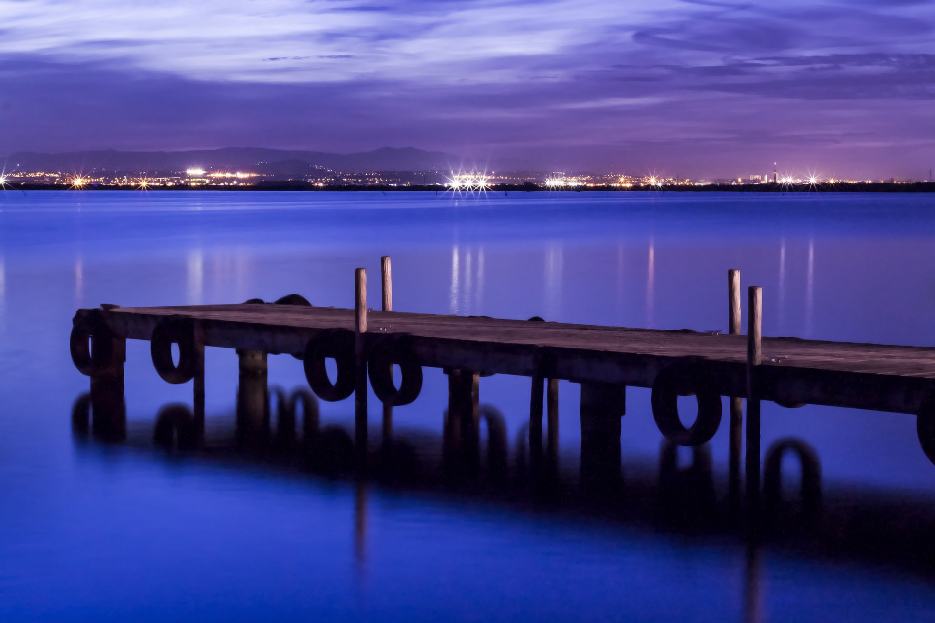 españa puerto mar costa puente luces iluminación noche azul púrpura cielo