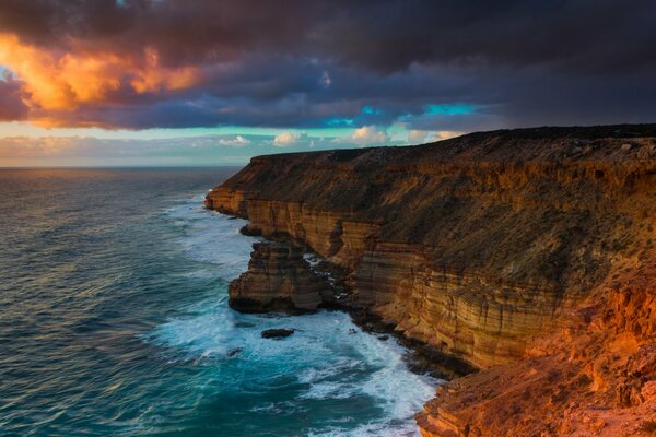 Cliff into the ocean at dawn