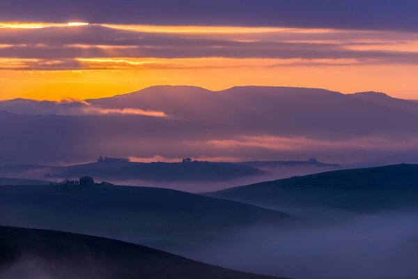 A beautiful landscape where sunset and fog merged