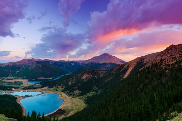 The beauty of the world in the USA is the state of Colorado with its peak mountain, lake, forest, incredible sunset and clouds in the sky