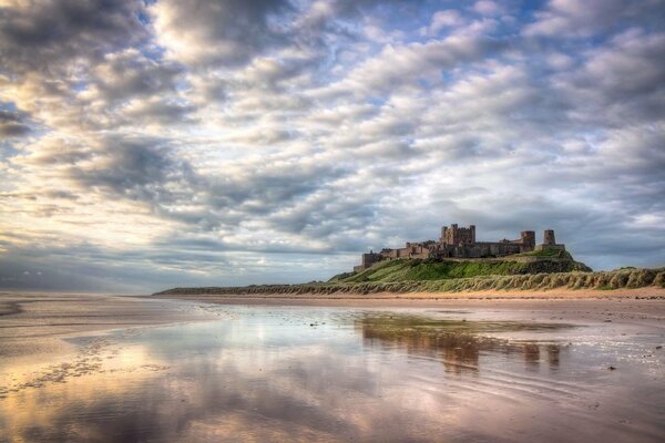 An impregnable gloomy castle on the coast