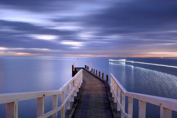 Bridge to the sea at sunset